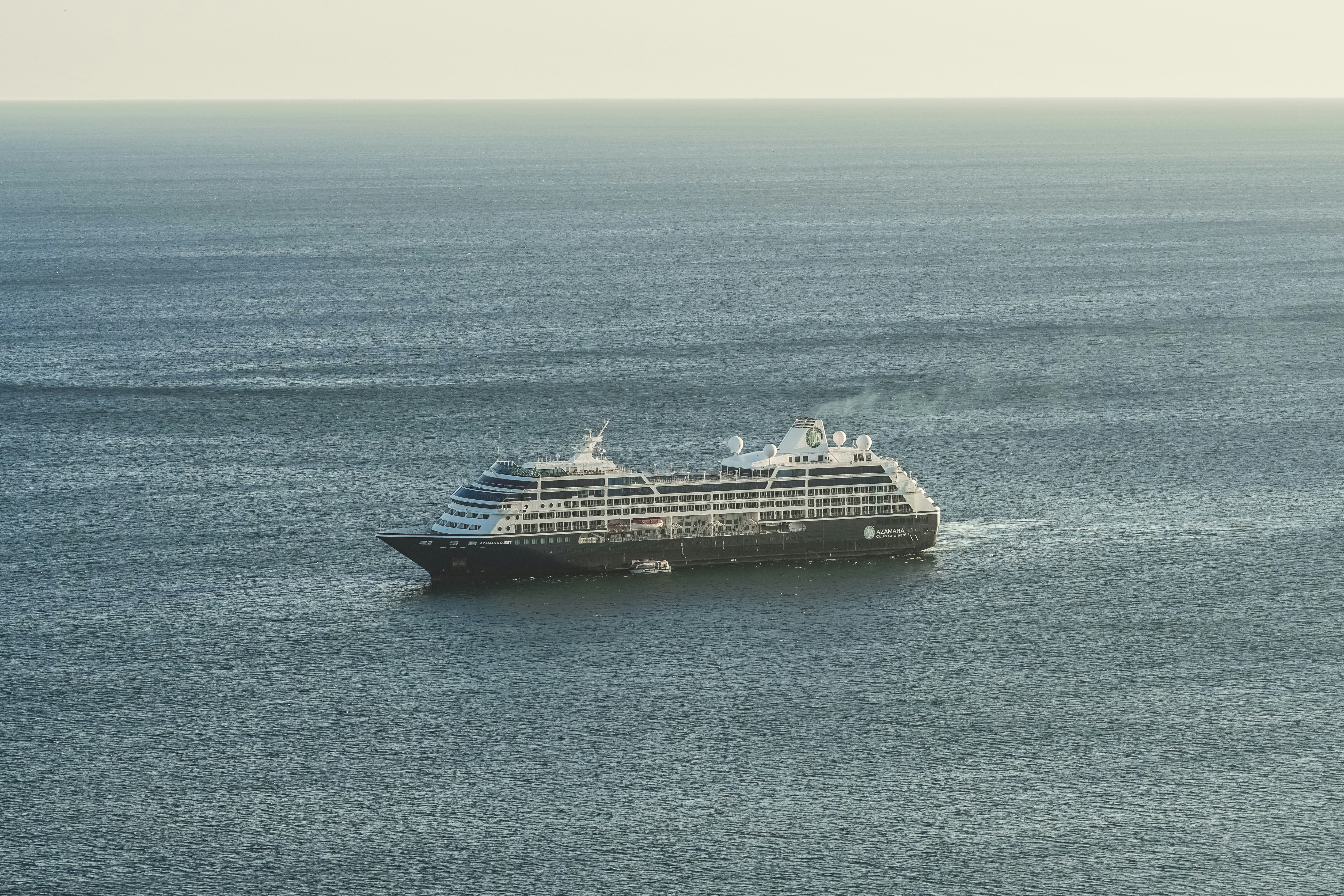 white and black cruise ship on sea during daytime